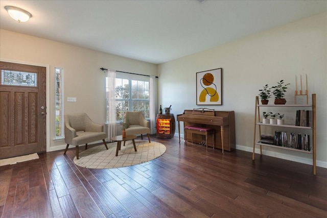 sitting room with dark hardwood / wood-style floors