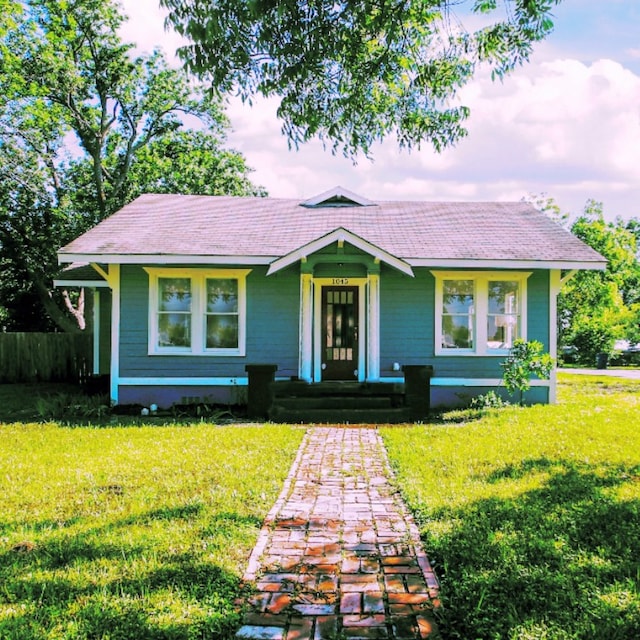 view of front of home with a lawn