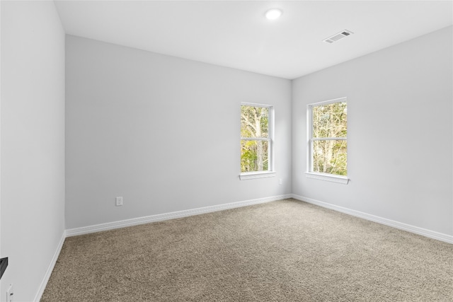 spare room featuring carpet flooring