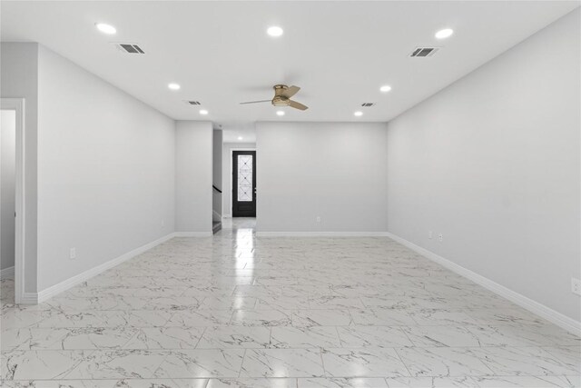 unfurnished room with ceiling fan