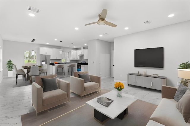 living room featuring ceiling fan