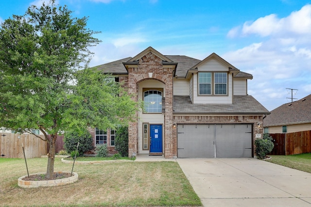 view of front of home with a garage and a front lawn