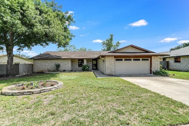 single story home with a garage and a front yard