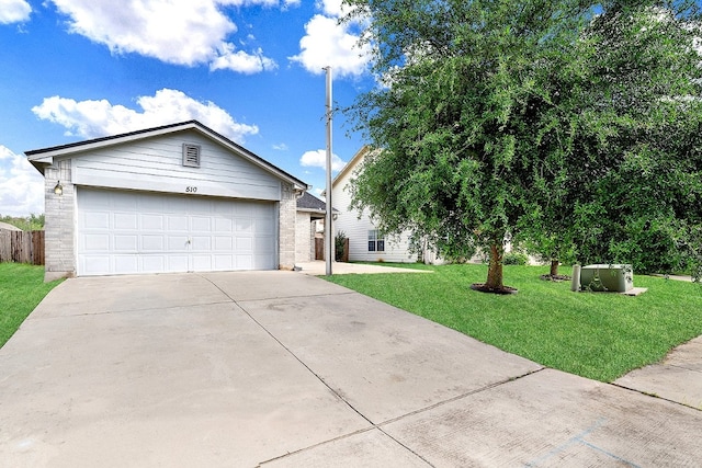 ranch-style house with a garage and a front lawn