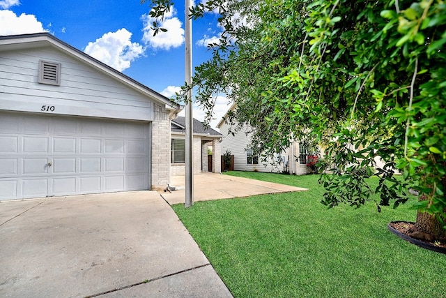 view of yard featuring a garage