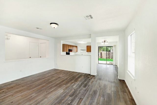 unfurnished living room featuring hardwood / wood-style flooring