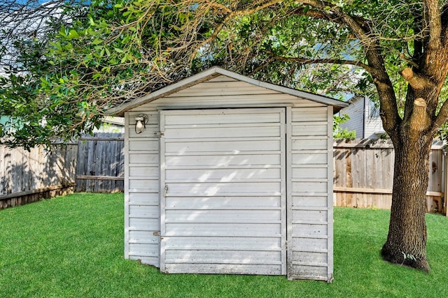 view of shed / structure with a lawn