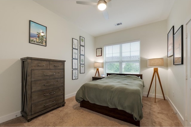 bedroom featuring ceiling fan and light colored carpet