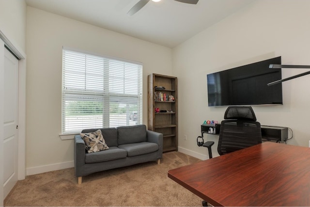 office area featuring light colored carpet and ceiling fan