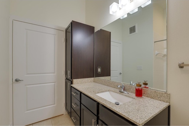 bathroom featuring vanity and tile patterned flooring