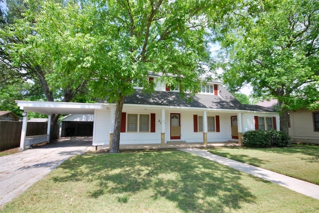 view of front of house featuring a carport, a porch, and a front lawn