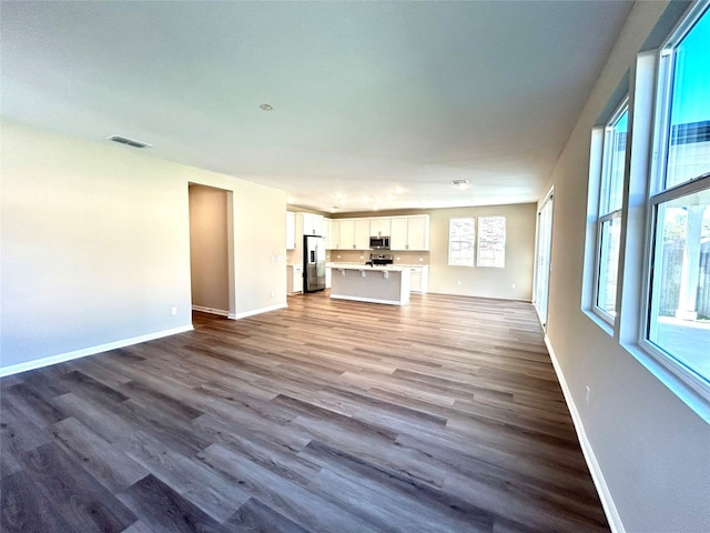 unfurnished living room with hardwood / wood-style flooring