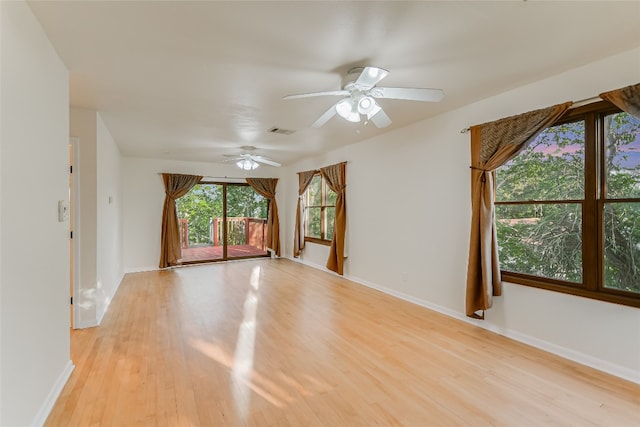 spare room featuring ceiling fan and light wood-type flooring