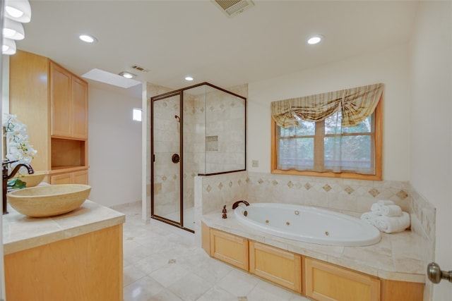 bathroom featuring sink, tile patterned flooring, separate shower and tub, and a healthy amount of sunlight