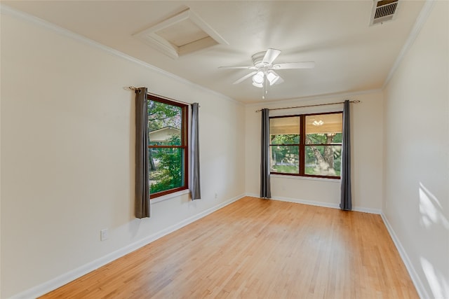 spare room featuring ceiling fan, plenty of natural light, and light hardwood / wood-style flooring