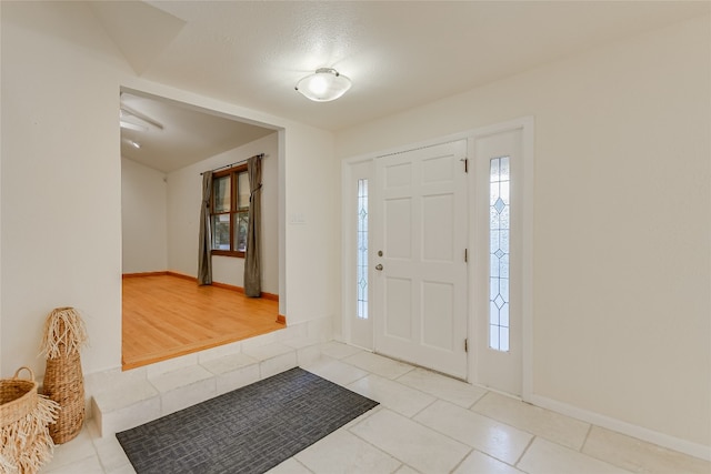 foyer with light hardwood / wood-style floors and plenty of natural light