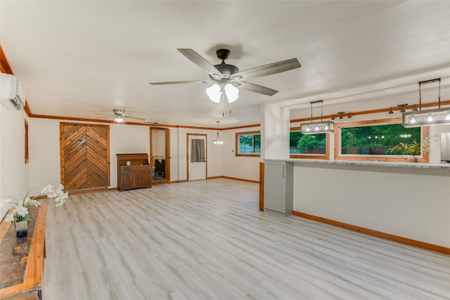 unfurnished living room with light hardwood / wood-style flooring, ceiling fan, and a wall mounted AC