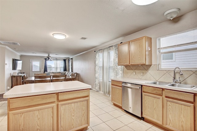 kitchen with stainless steel dishwasher, sink, ceiling fan, and light tile floors