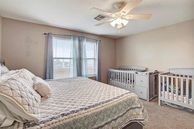 carpeted bedroom with ceiling fan