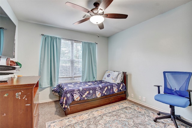 bedroom with ceiling fan and carpet flooring