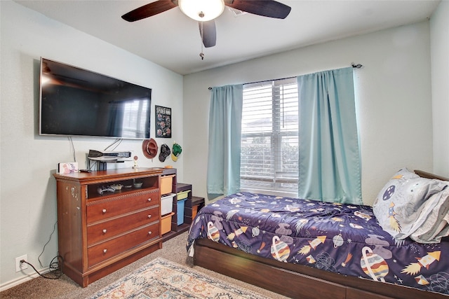 bedroom with ceiling fan and carpet flooring