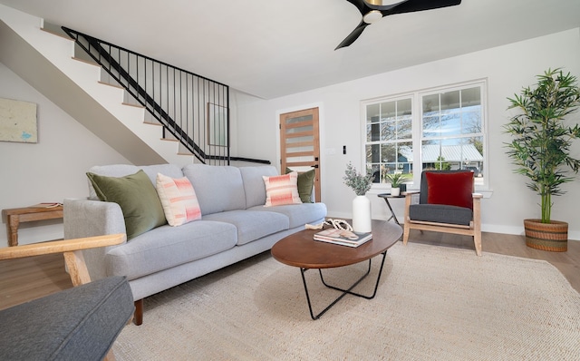 living room with ceiling fan and hardwood / wood-style floors