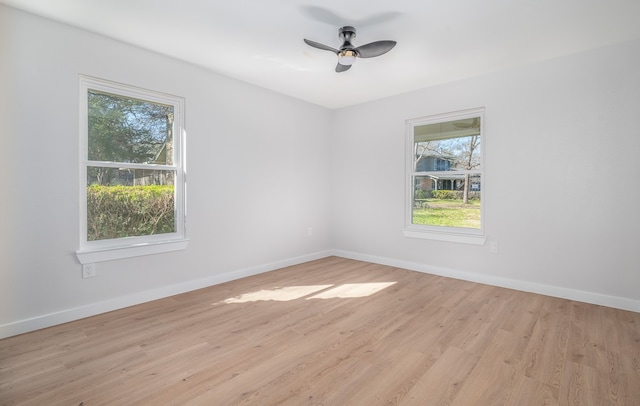 unfurnished room with light hardwood / wood-style flooring and ceiling fan