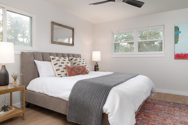 bedroom featuring ceiling fan and hardwood / wood-style flooring