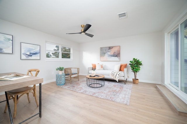 interior space with light hardwood / wood-style floors and ceiling fan