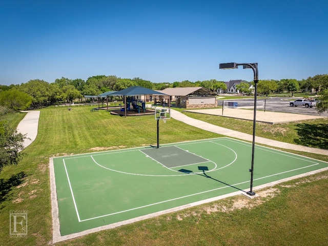 view of sport court featuring a lawn and a playground