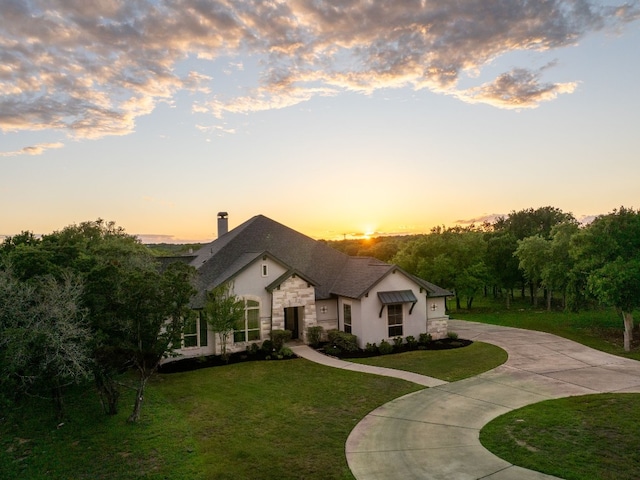 view of front of property with a lawn