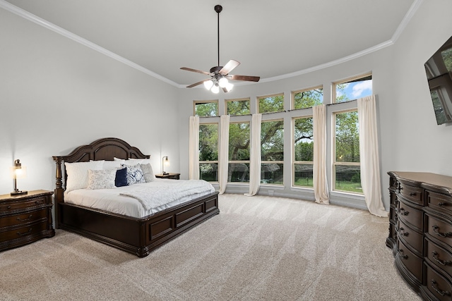 bedroom featuring light carpet, crown molding, and ceiling fan