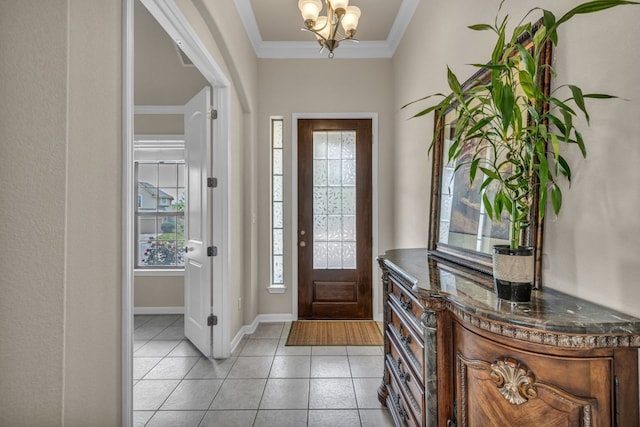 entrance foyer with light tile flooring, crown molding, and an inviting chandelier