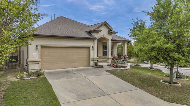 view of front facade featuring a garage and a front yard