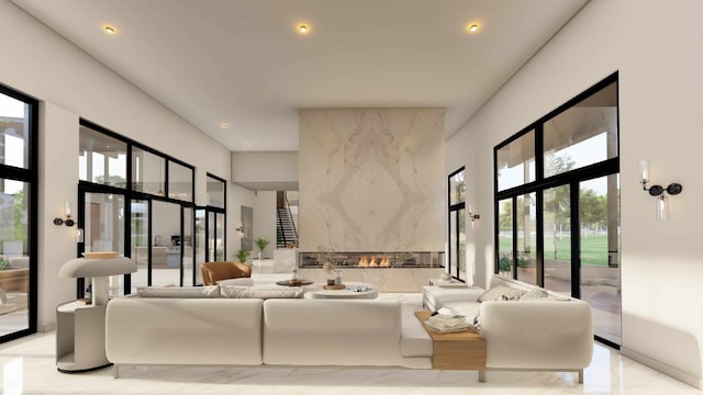 living room featuring a high end fireplace