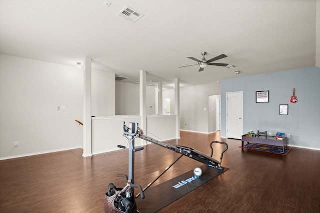 exercise room featuring dark hardwood / wood-style flooring and ceiling fan