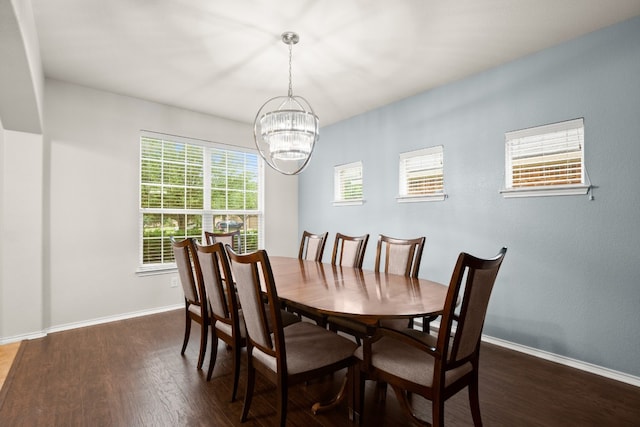 dining room featuring a chandelier and dark hardwood / wood-style floors