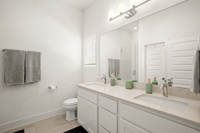 bathroom with toilet, tile patterned floors, and dual bowl vanity