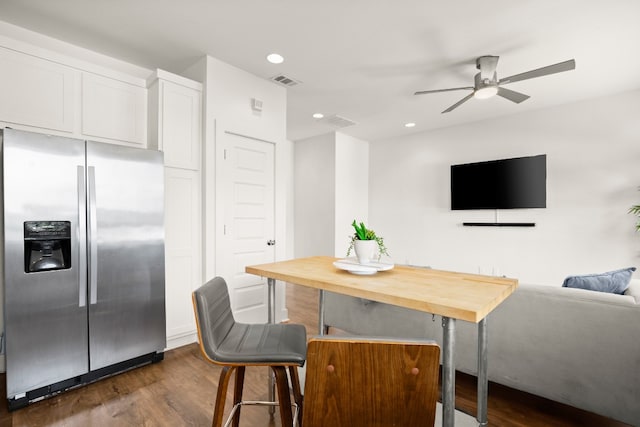 interior space with dark wood-type flooring and ceiling fan