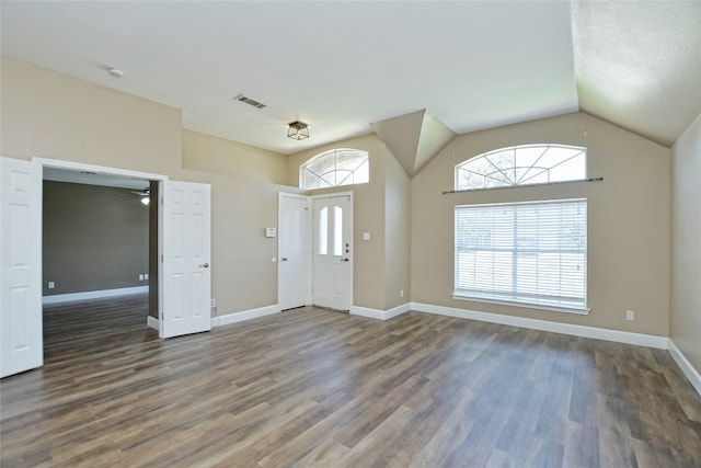 foyer featuring dark wood-type flooring, lofted ceiling, and ceiling fan