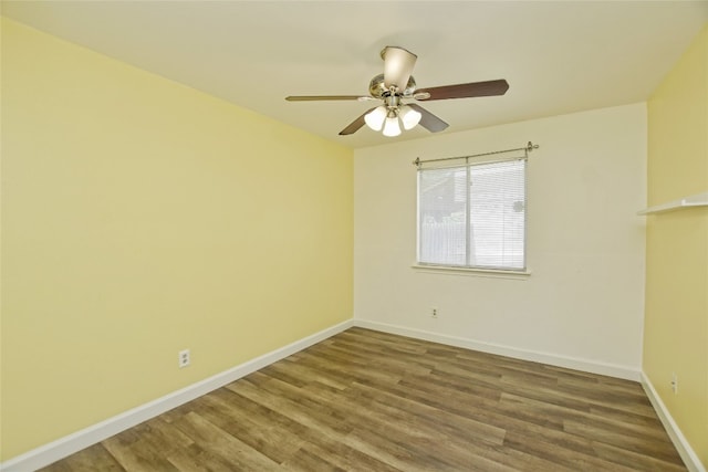 spare room featuring hardwood / wood-style flooring and ceiling fan