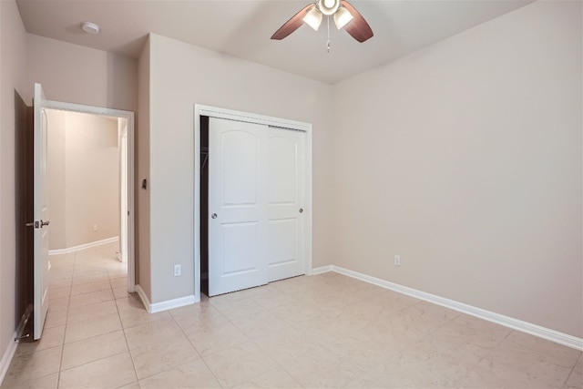 unfurnished bedroom featuring a closet, ceiling fan, and light tile floors