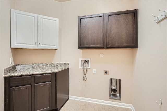 laundry area with cabinets, light tile floors, electric dryer hookup, washer hookup, and gas dryer hookup