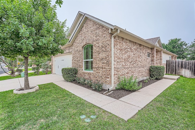 view of property exterior featuring a lawn and a garage