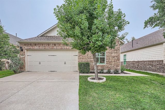 view of front of property with a garage and a front yard