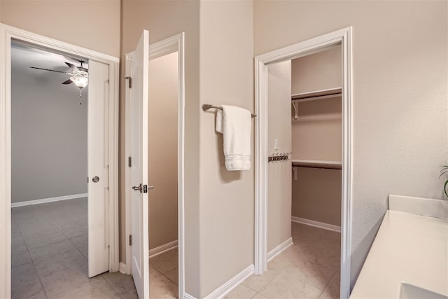 bathroom featuring tile flooring and ceiling fan