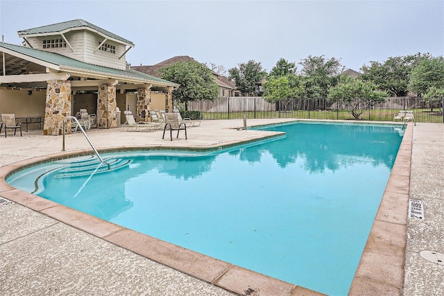 view of swimming pool featuring a patio