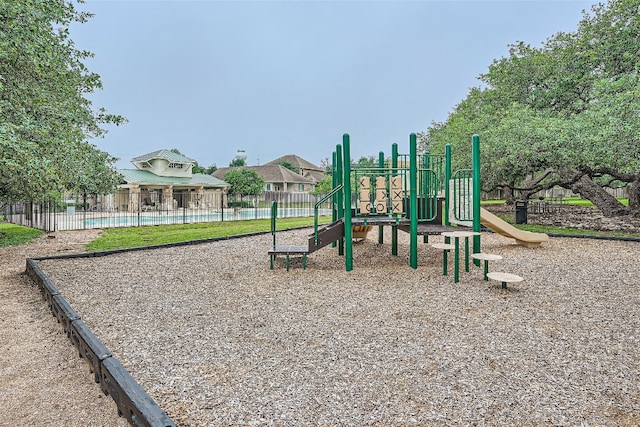 view of play area featuring a community pool