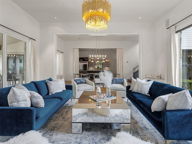 living room featuring a notable chandelier