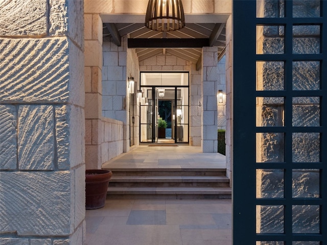 view of exterior entry featuring french doors